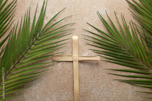 Slika na platnu Palm cross and palm leaves. Palm sunday and easter day concept.