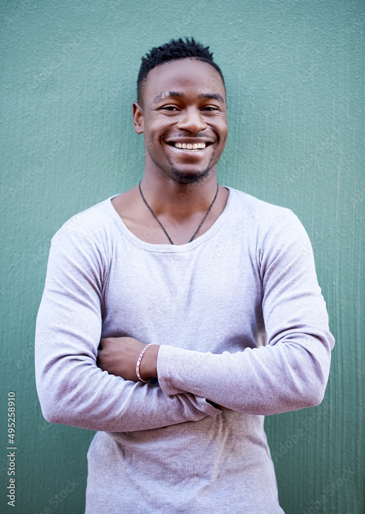 Life is something you should always smile about. Shot of a handsome young man out in the city. Life is something you should always smile about. Shot of a handsome young man out in the city.