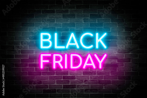 Black Friday sale neon banner on brick wall background, marketing signboard.