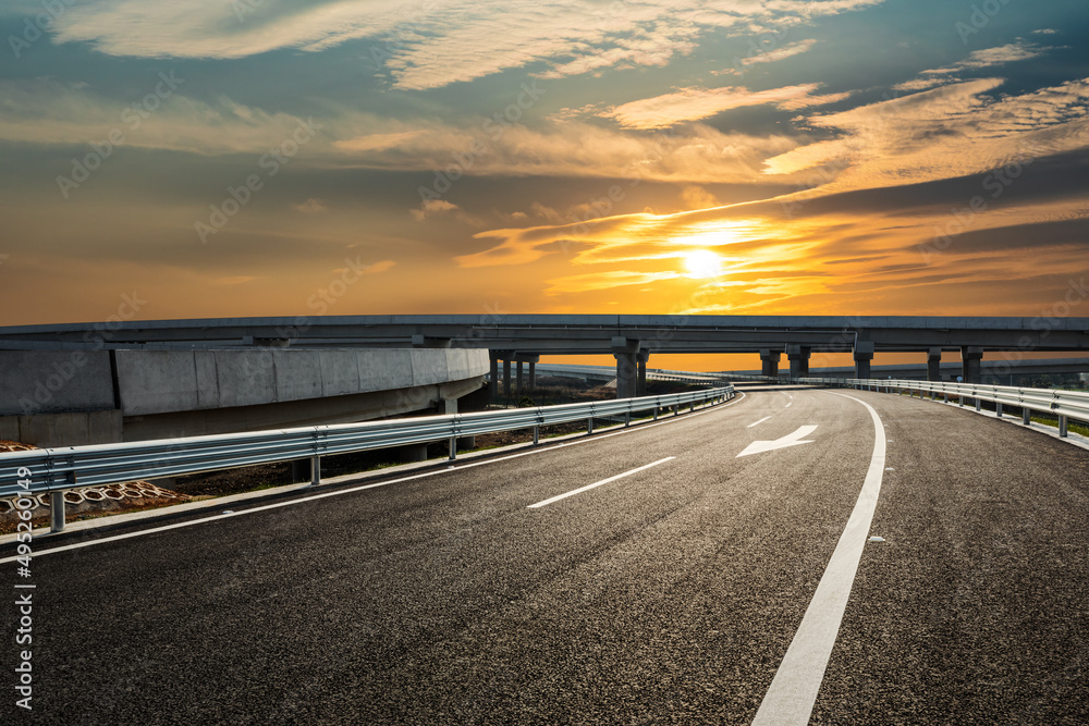 Fototapeta premium Asphalt highway and beautiful sky cloud landscape at sunset. Road and sky cloud background.