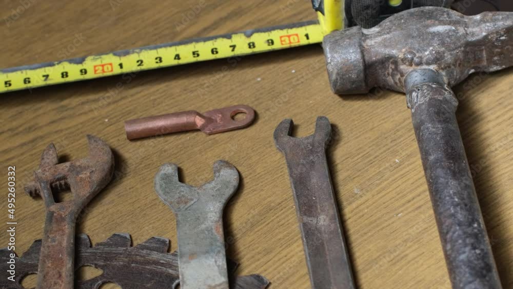 Old rusty tools on the wooden table Old rusty tools on the wooden table