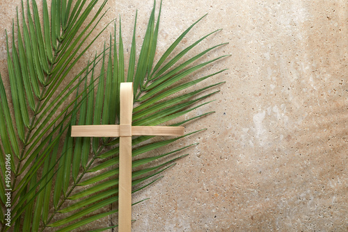 Palm cross and palm leaves. Palm sunday and easter day concept.