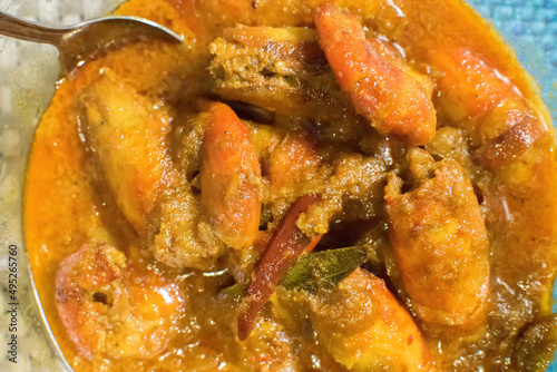 Orange coloured Prawns, cooked and served in a bowl, Indian delicacy food - called 
