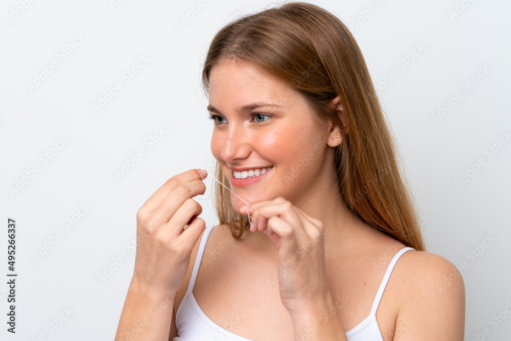 Young caucasian woman isolated on white background with dental floss. Close up portrait Young caucasian woman isolated on white background with dental floss. Close up portrait