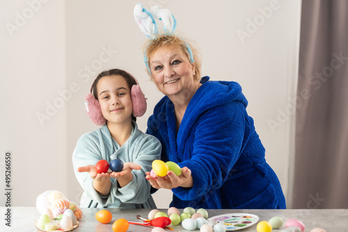Photography family grandmother and child granddaughter with ears hare getting ready for holi