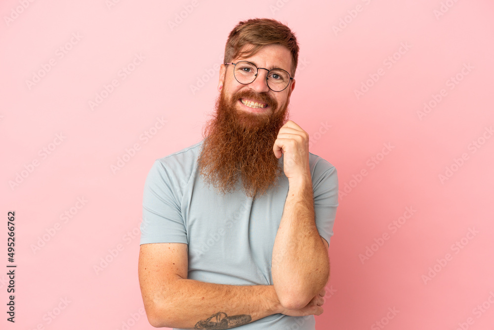 Young reddish caucasian man isolated on pink background laughing Young reddish caucasian man isolated on pink background laughing