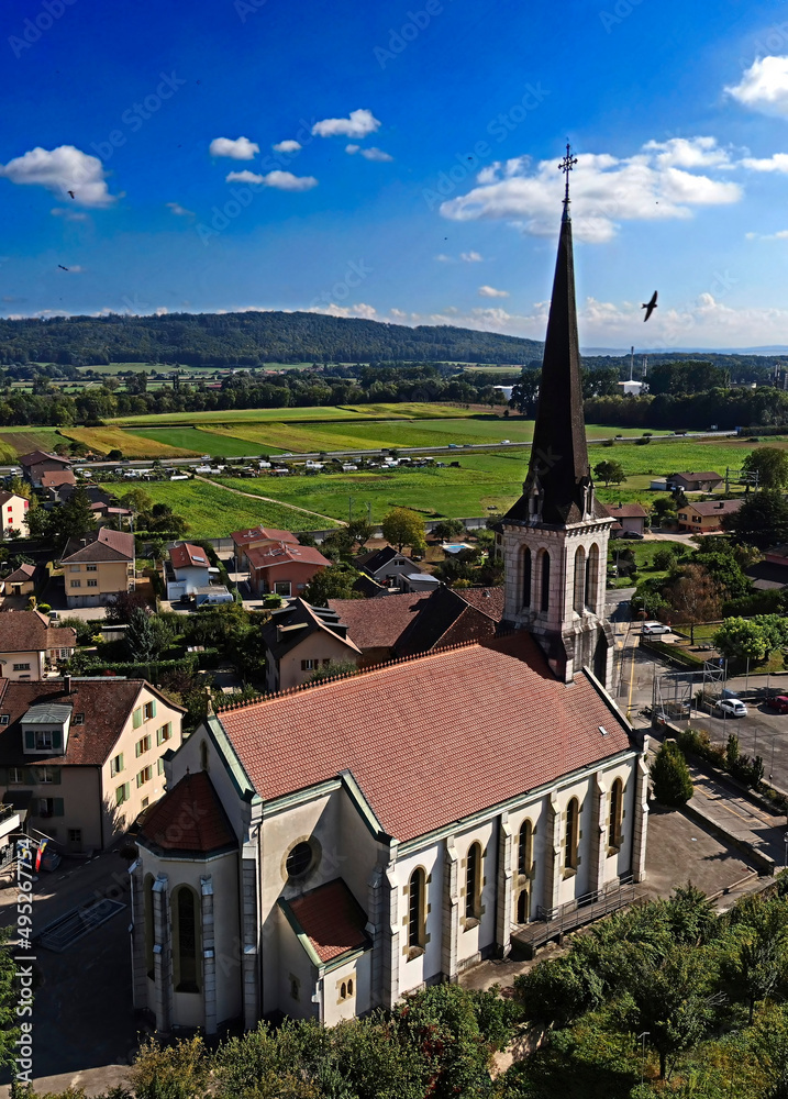 Panoramic view to St. Martin church. Village of Cressier, Switzerland. Year of construction - 1875