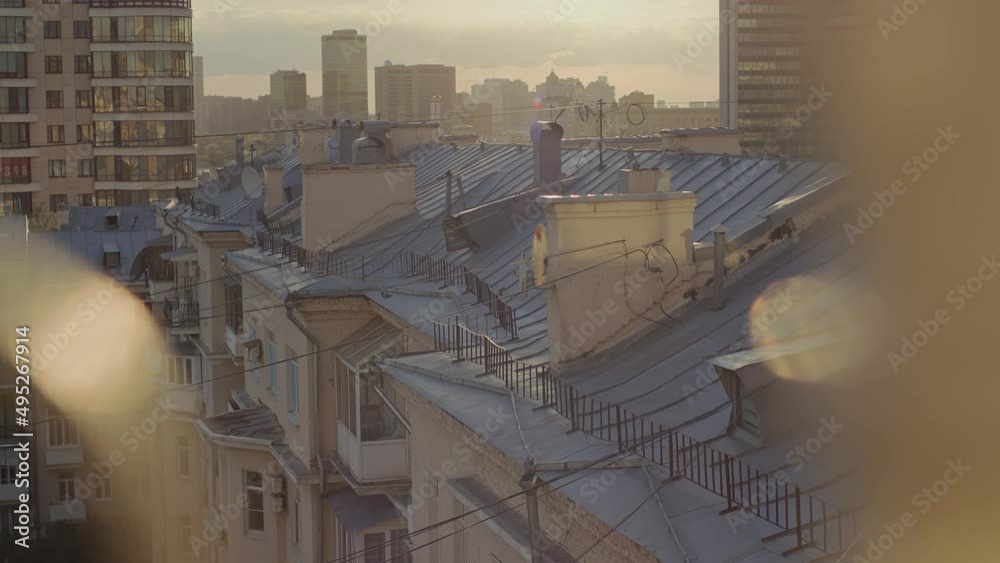 A cinematic shot of the city in the rays of the setting sun. A cinematic shot of the city in the rays of the setting sun.