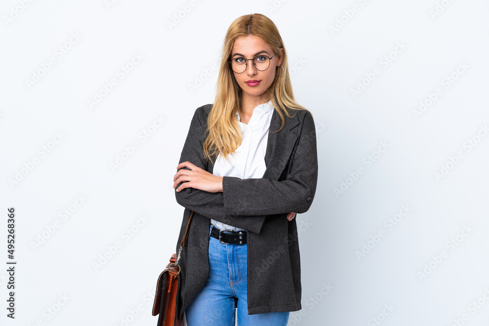 Business Uruguayan woman over isolated white background keeping arms crossed Business Uruguayan woman over isolated white background keeping arms crossed