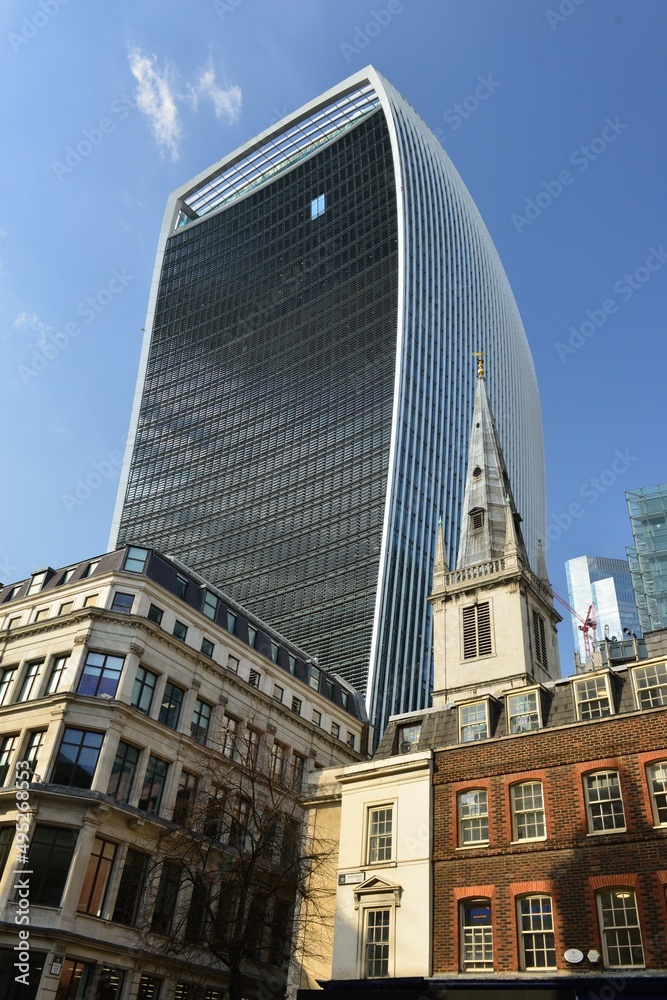 The Walkie-Talkie building, London, U.K. A towering skyscraper over traditional building.