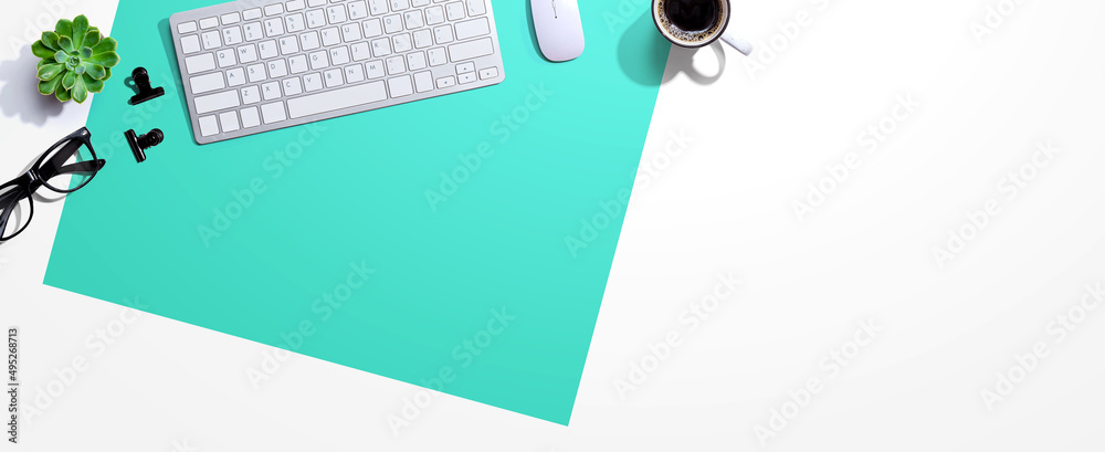 Computer keyboard with a cup of coffee and eyeglasses - flat lay - obrazy, fototapety, plakaty 