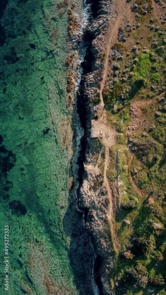 Aerial drone view of clear green sea and cliff Aerial drone view of clear green sea and cliff