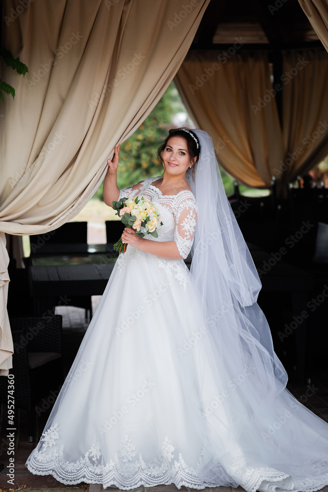 Satisfied and happy bride with bright emotions. Wedding day, autumn mood