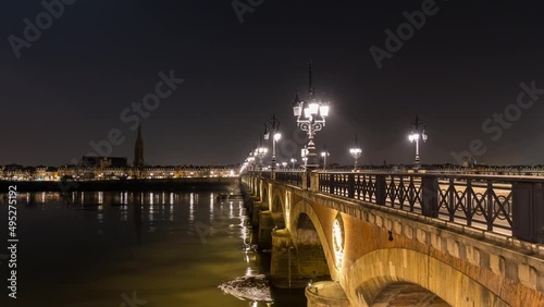 Stone Bridge in Bordeaux at Night With Tramway and River
