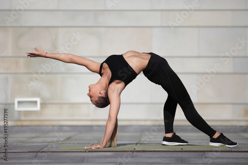 fitness woman with a sports figure doing stretching