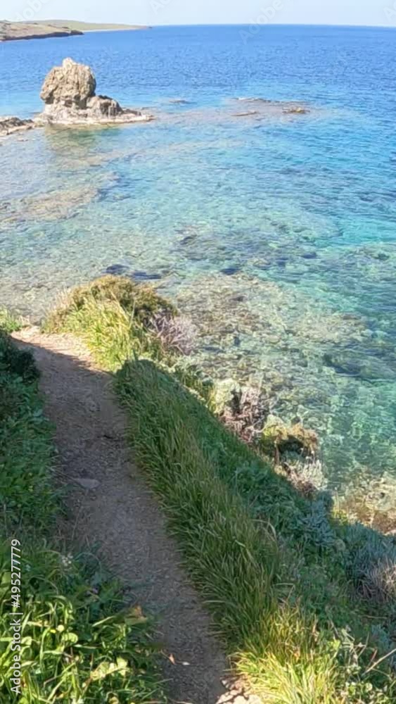 Point of view of pathway by blue sea Point of view of pathway by blue sea