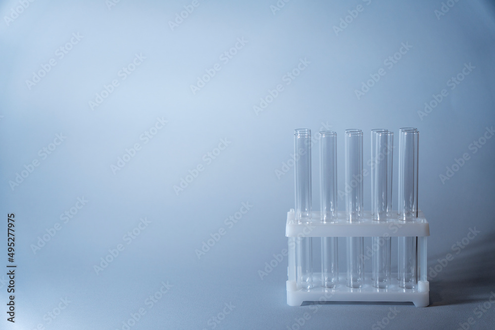 Close up view of transparent glass test tubes for biological research.Isolated on background. Laboratory tests and research.Chemistry science or medical biology experiment.Laboratory background Close up view of transparent glass test tubes for biological research.Isolated on background. Laboratory tests and research.Chemistry science or medical biology experiment.Laboratory background