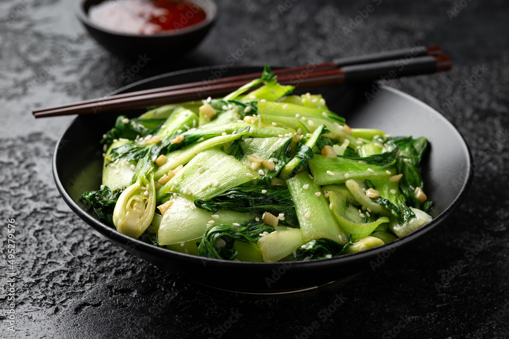 Fototapeta Chinese fried Pak Choi with garlic, sesame seeds. Healthy food