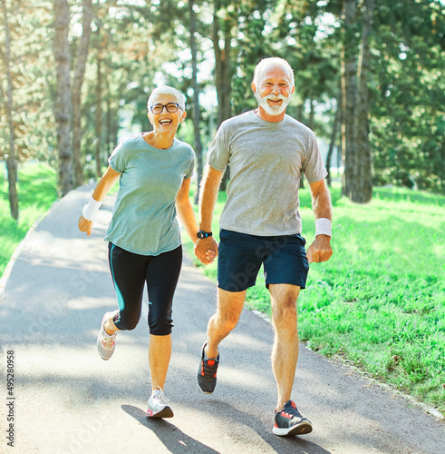 Fototapeta Naklejka Na Ścianę i Meble -  outdoor senior fitness woman man lifestyle active sport exercise healthy fit retirement