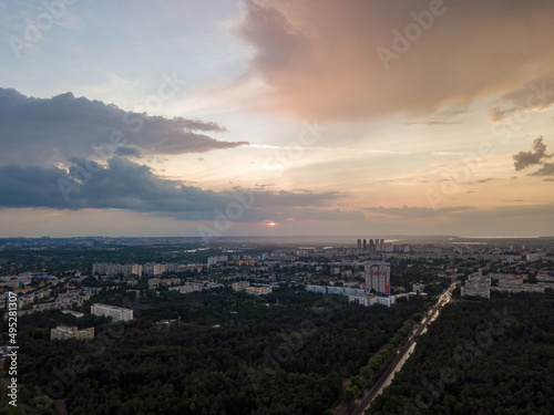 Fototapeta Naklejka Na Ścianę i Meble -  Sunset over Kiev. Rain clouds in the sky. Aerial drone view.
