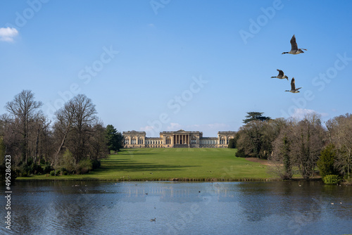 Stowe House with geese flying overhead