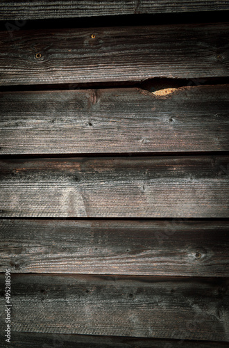 Wallpaper Mural Detail of a wall of an old mountain barn. Dark, aged wooden background. Vertical image. Torontodigital.ca