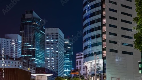 Colorful La Defense District Towers at Night With Moonset Crescent