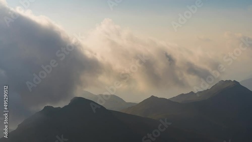 Mist and Clouds Moving Over Mountains Peaks in the French Alps at Morning
