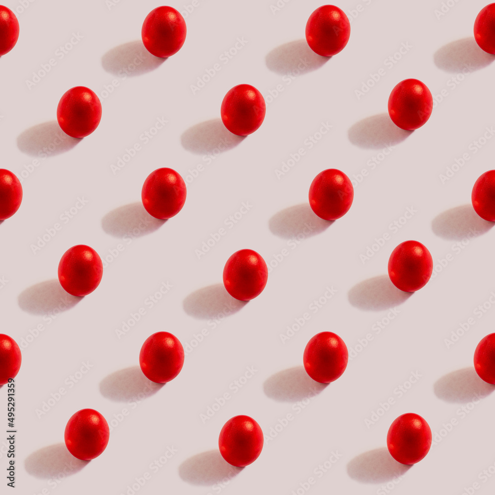 Pattern of red eggs on a cream background. The concept of minimal food.Easter eggs. Pattern of red eggs on a cream background. The concept of minimal food.Easter eggs.