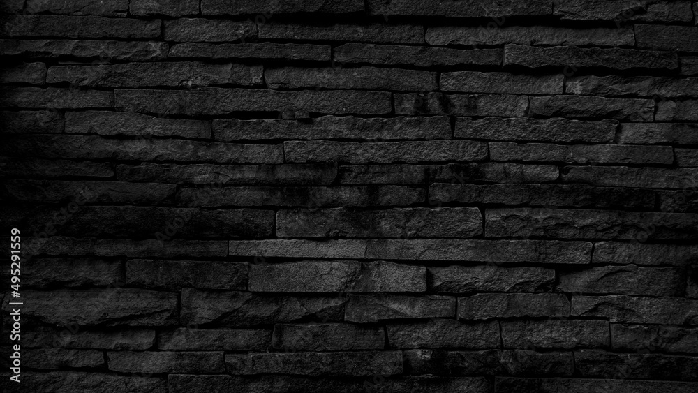 black brick wall background dark stone texture.    