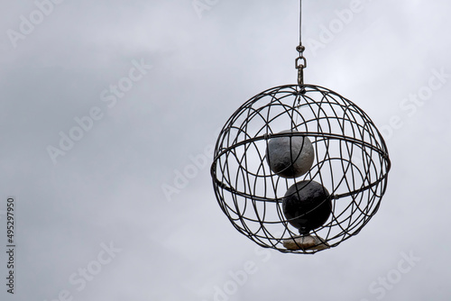 Ball hanging in the sky with two balls