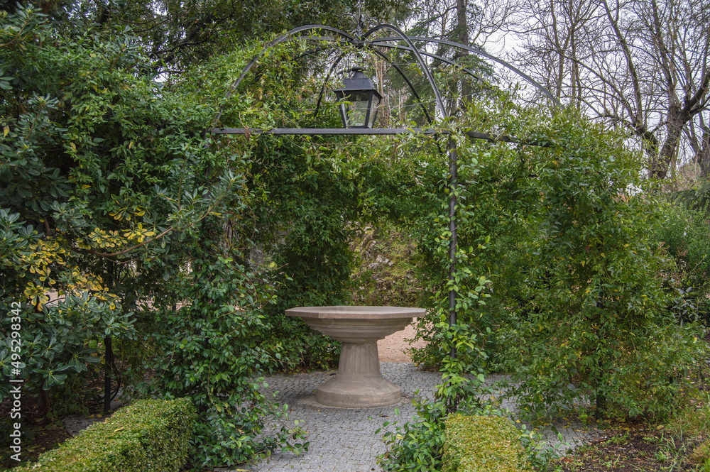 Gazebo with stone table in the historic gardens of the fincaa de Vista Alegre in Madrid