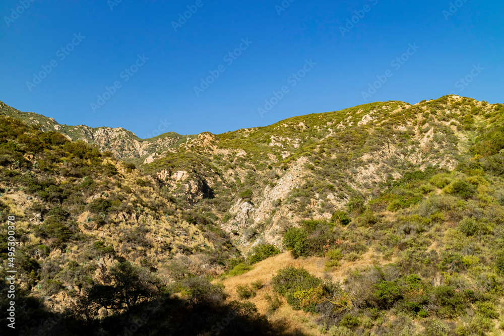 Sunny view of hiking in a rural trail of San Gabriel Mountains