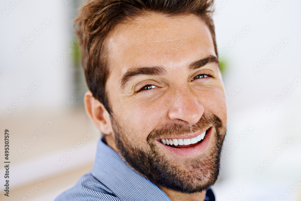 Fototapeta premium Lifes full of reasons to smile. Portrait of a smiling man in his home.