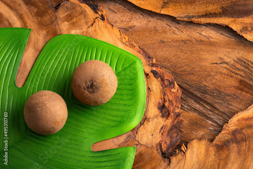 Organic sapodilla tropical fruit - Manilkara zapota photo