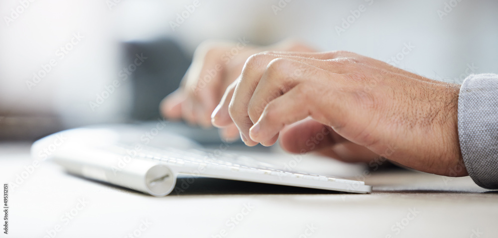 This is my dream keyboard. Shot of a businessman typing on his keyboard. This is my dream keyboard. Shot of a businessman typing on his keyboard.