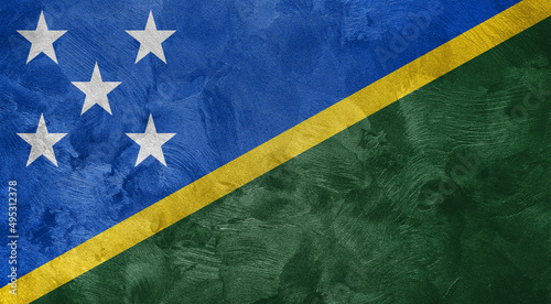Textured photo of the flag of Solomon Islands.