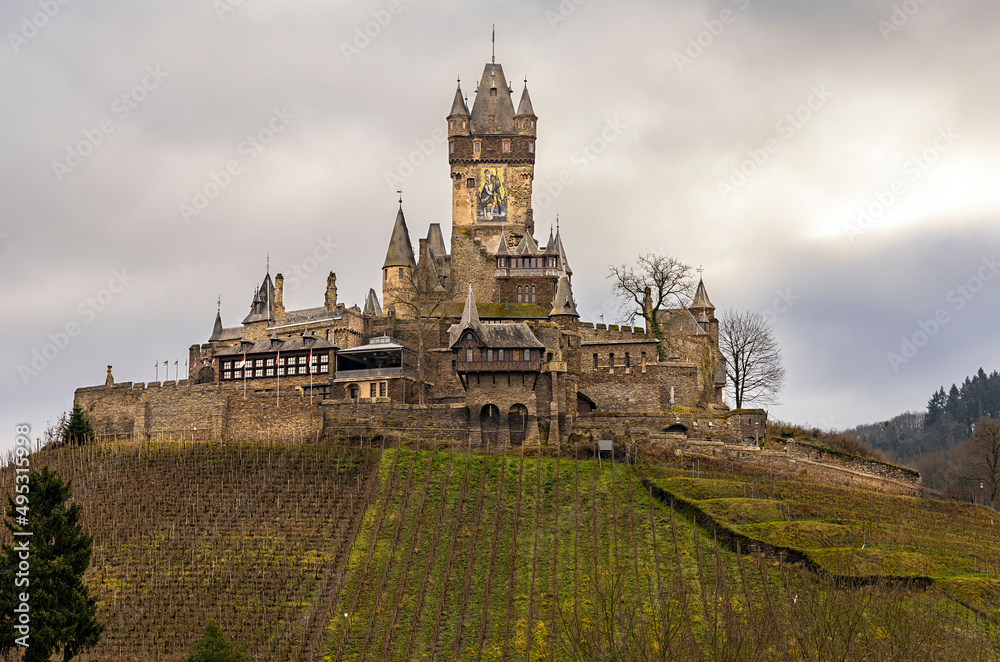 Obraz premium Cochem, Germany, a beautiful historic city on the Moselle river, a view of the Reichsburg castle, located on a hill