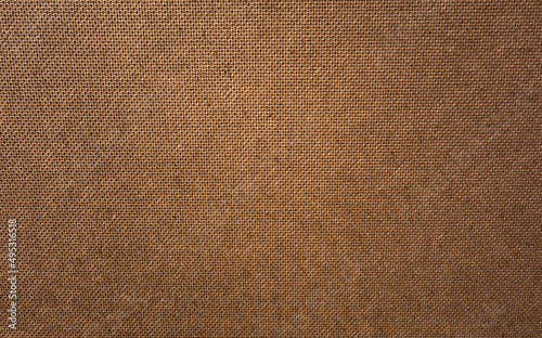 The texture of hard cardboard for the manufacture of audio speakers and furniture. The pure brown texture of the cardboard sheet .Brown background made of pressed paper.