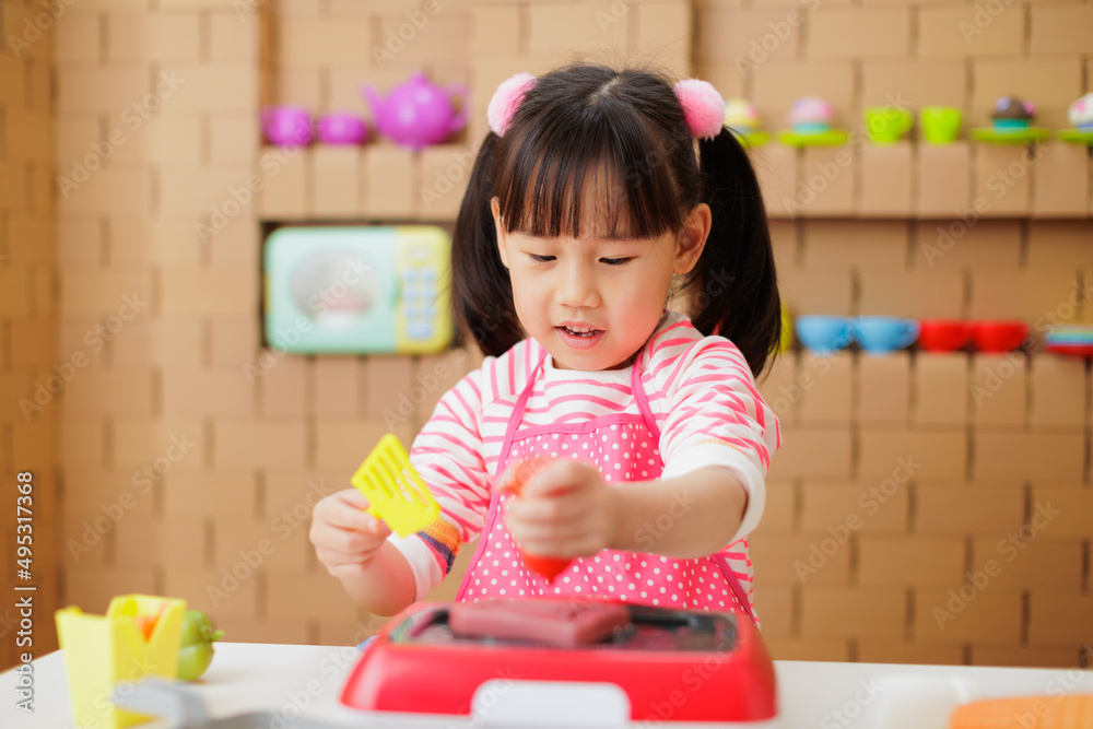 young girl pretend playing food preparing at home young girl pretend playing food preparing at home