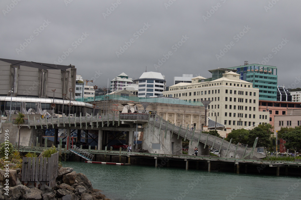City to sea bridge with heavy clouds on background, Wellington, New Zealand.