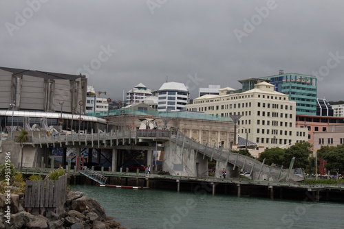 City to sea bridge with heavy clouds on background, Wellington, New Zealand.