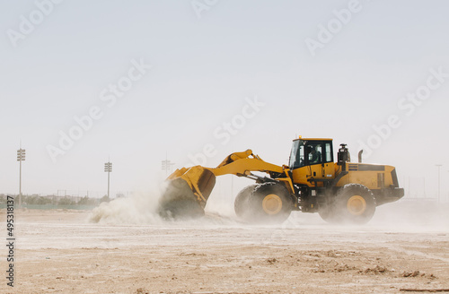 Dozer, excavator, and road rollers working on the mud site