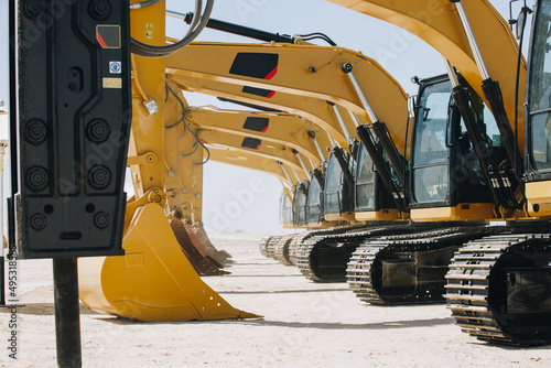 Dozer, excavator, and road rollers working on the mud site