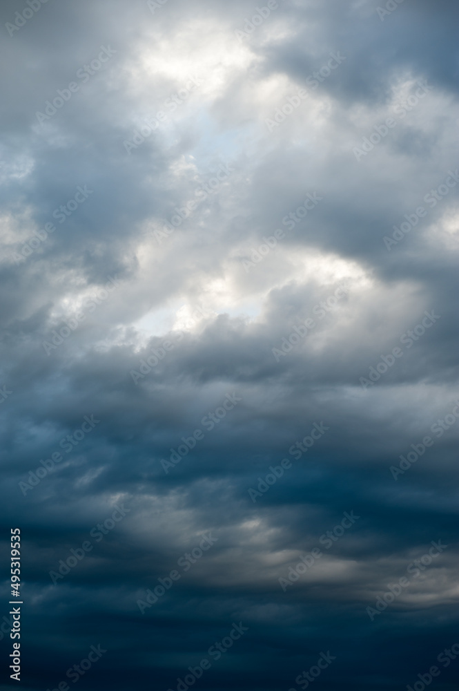 Stormy skies with dramatic clouds from approaching thunderstorms at sunset