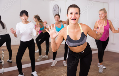 Ordinary active females exercising dance moves. High quality photo