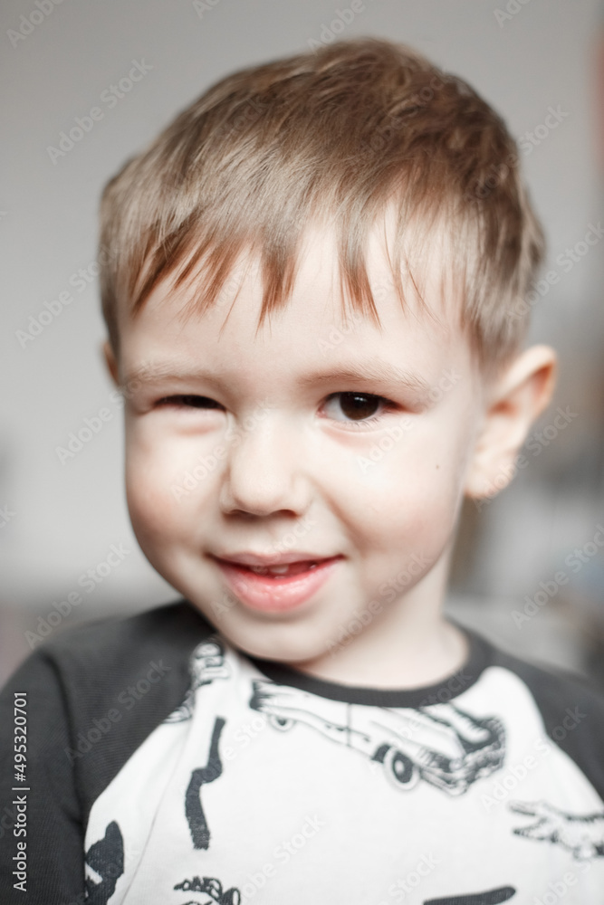 Little Caucasian boy smiling and looking at camera, lifestyle photography Little Caucasian boy smiling and looking at camera, lifestyle photography