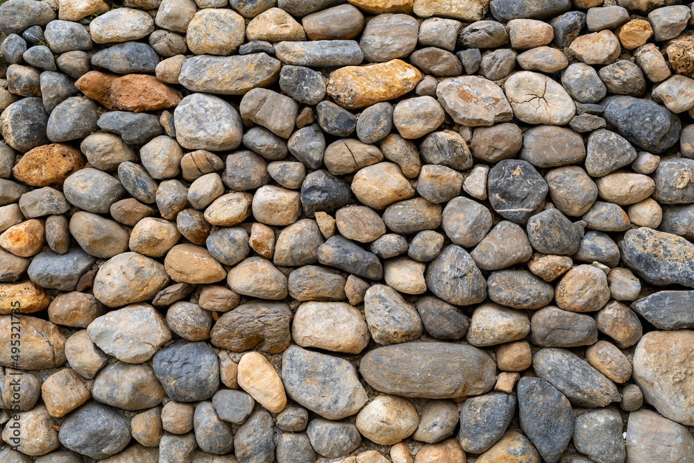 Stacked stones as an decorative object in the yard. background texture or pattern concept. Stacked stones as an decorative object in the yard. background texture or pattern concept.