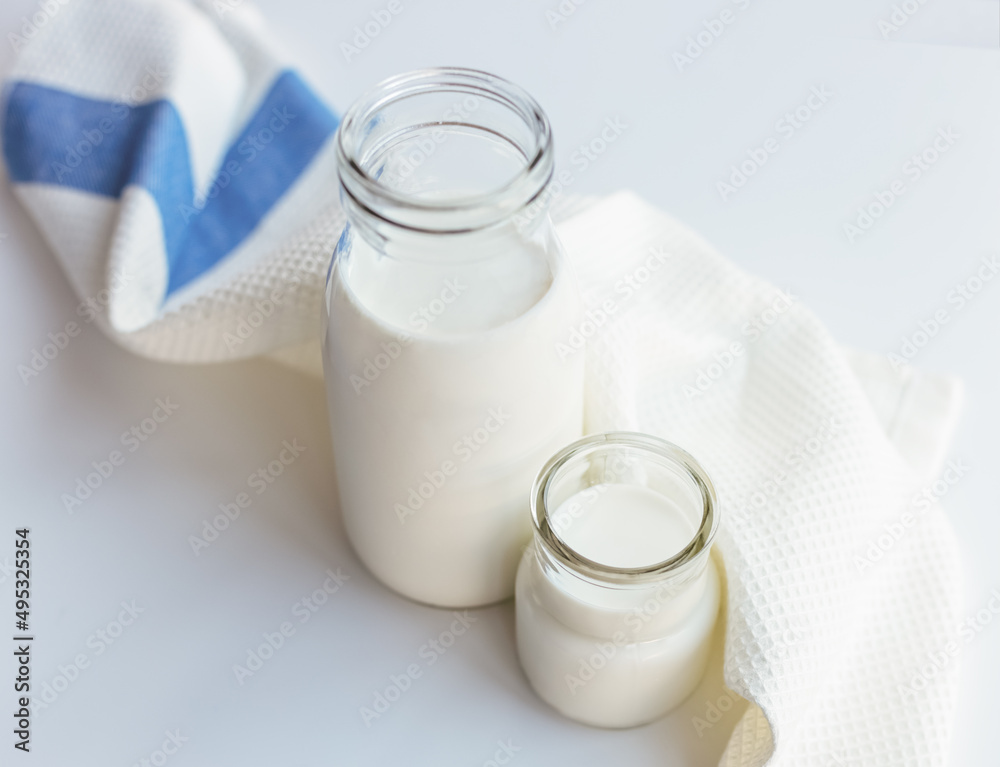 Glass bottles with milk on the table. Glass bottles with milk on the table.