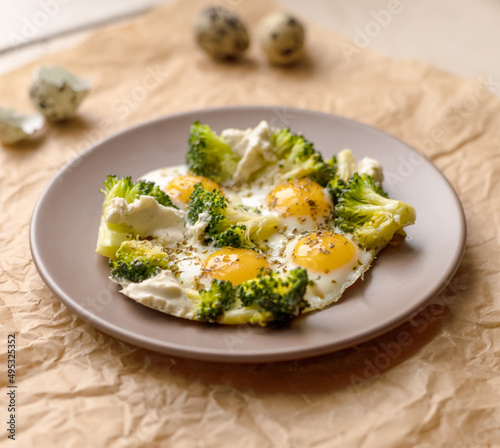 Breakfast with quail eggs, broccoli and cheese.